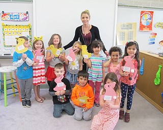 Neighbors | Alexis Bartolomucci.Samantha Cox and her class held up the bunny and duck craft they made during their Easter celebration on April 13 at North Preschool.