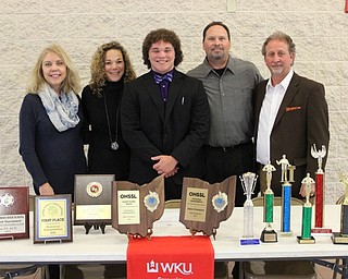 Neighbors | Abby Slanker.Canfield High School senior Zachery Bernat was surrounded by his family, from left, Laurie Lesitsky, Mary Kay Bernat, Bernat, Bob Bernat and Dan Donofrio, as he signed his letter of intent to continue his Speech and Debate career at Western Kentucky University on April 13.