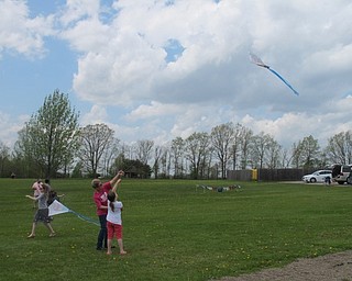Neighbors | Alexis Bartolomucci.Children spent the afternoon flying kites they got at the seventh annual Kids Shine 4 a Cure Kite Festival at Austintown Park.