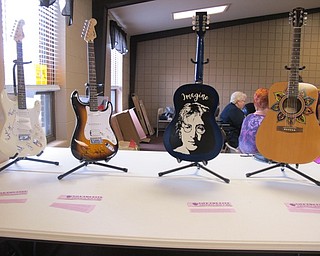 Neighbors | Alexis Bartolomucci.Four guitars, including two autographed ones, were set out for auction during the Kids Shine 4 a Cause Kite Festival at Austintown Park.