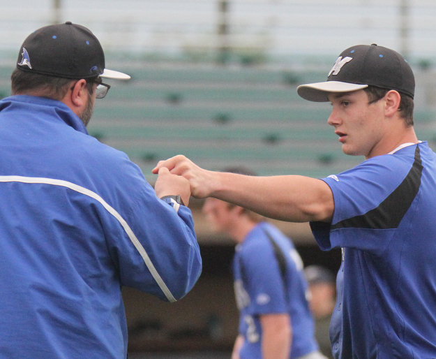 William D. Lewis The Vindicator Jackson Milton closer  Noah Lester fist bumps coach???? during 5-11-17 win over Lowellville.