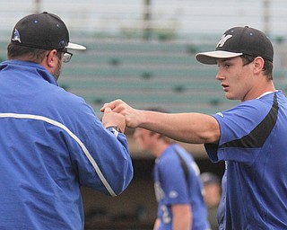 William D. Lewis The Vindicator Jackson Milton closer  Noah Lester fist bumps coach???? during 5-11-17 win over Lowellville.