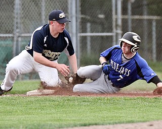 William D. Lewis The Vindicator Jackson Milton's Eric Ostrowski(7 ) is tagged out at 3rd by Lowellville's Bryan Harris(22) during 5-11-17 game.