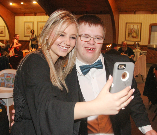 William D Lewis The Vindicator  Cassie Saylor,a volunteer and Canfield HS student takes a selfie with Nicholas Campos also a Canfield student at special needs prom 5-12-17.