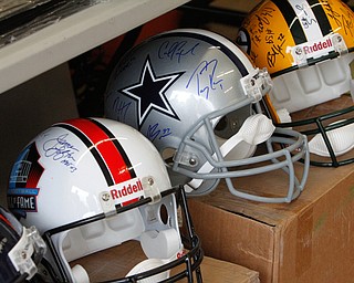        ROBERT K. YOSAY  | THE VINDICATOR..Items confiscated from a ring dealing in fraudulent sports memorabilia will find a second life in the hands of local kids in need according to Canfield