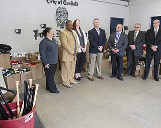        ROBERT K. YOSAY  | THE VINDICATOR..Items confiscated from a ring dealing in fraudulent sports memorabilia will find a second life in the hands of local kids in need according to Canfield Det Brian McGivern.Randi Russell Boys and Girls Club - Delmas (ok) Stubbs with veteran services - Jennifer Gray with Compass-Canfield Chief  chuck Colucci  Det Brian McGivern asst prosecuotr  Nick Modarelli and FBI Todd Werth