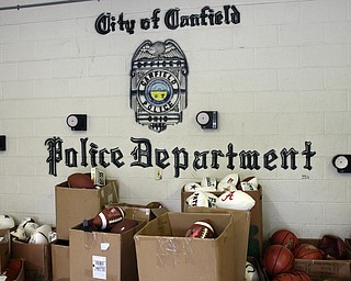        ROBERT K. YOSAY  | THE VINDICATOR..Items confiscated from a ring dealing in fraudulent sports memorabilia will find a second life in the hands of local kids in need according to Canfield