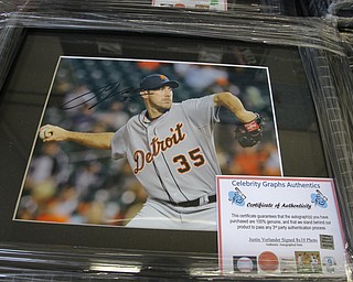        ROBERT K. YOSAY  | THE VINDICATOR..Items confiscated from a ring dealing in fraudulent sports memorabilia will find a second life in the hands of local kids in need according to Canfield