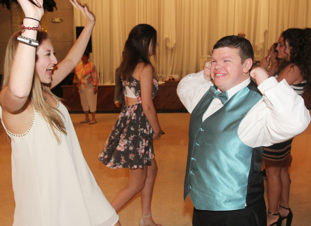 William D Lewis The Vindicator  Lexi Burdman, a Canfield HS junior and volunteer at special needs prom dances with special needs student Zachary Howard.