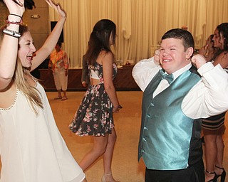 William D Lewis The Vindicator  Lexi Burdman, a Canfield HS junior and volunteer at special needs prom dances with special needs student Zachary Howard.