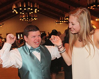 William D Lewis The Vindicator  Lexi Burdman, a Canfield HS junior and volunteer at special needs prom dances with special needs student Zachary Howard.