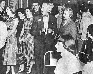 .Vindicator file photo | May 16, 1954.A good deal of the credit for the exceptionally high morale and fine records at the Air Force‚Äôs jet air base at the Youngstown Municipal Airport can go to the Youngstown -Mahoning County USO Committee which has gone all out to keep the enllisted men entertained with weekly dances, dinners and other entertainment. Most popular is the junior hostess program sponsored jointly with with YWCA and and the recent dance brought out the enlisted men in droves to dance with pretty girls, watch a floor show and enjoy a midnight snack. Above, City Parl Supt. Tom Pemberton (center) helps entertain the servicemen.