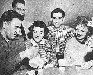 Vindicator file photo | May 16, 1954A good deal of the credit for the exceptionally high morale and fine records at the Air Force‚Äôs jet air base at the Youngstown Municipal Airport can go to the Youngstown -Mahoning County USO Committee which has gone all out to keep the enllisted men entertained with weekly dances, dinners and other entertainment. Most popular is the junior hostess program sponsored jointly with with YWCA and and the recent dance brought out the enlisted men in droves to dance with pretty girls, watch a floor show and enjoy a midnight snack. Above, Relaxing over a cup of coffee are A1C Wayne E. Underwood, S.Sgt. Bob Thayer, Rose Ann Whalen, A1C Louis Ventraesco and Virginia Vallinger.