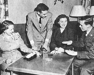 Vindicator file photo | May 16, 1954A good deal of the credit for the exceptionally high morale and fine records at the Air Force‚Äôs jet air base at the Youngstown Municipal Airport can go to the Youngstown -Mahoning County USO Committee which has gone all out to keep the enllisted men entertained with weekly dances, dinners and other entertainment. Most popular is the junior hostess program sponsored jointly with with YWCA and and the recent dance brought out the enlisted men in droves to dance with pretty girls, watch a floor show and enjoy a midnight snack. Above, The proper way to bank a jet is demonstrated by A3C Francis Lunsford to Beverly collins, A1C Ralph williams and Barbara Razo.