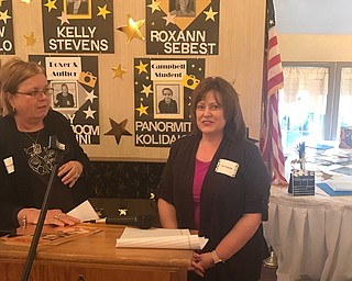 SPECIAL TO THE VINDICATOR
Julie Pagnotta, right, recently received the Commitment to Literacy Award from the Mahoning Valley Council of the International Reading Association. A reception took place at A La Cart Catering in Canfield. Pagnotta is an early childhood instructor at the Mahoning County Career and Technical Center, and has been teaching there since 1987. She was nominated by coworker Terry Billock, left, for sharing her love of literature and promoting the importance of reading throughout her teaching career.