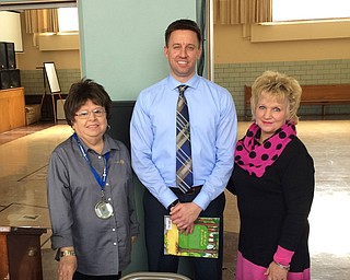 SPECIAL TO THE VINDICATOR
Ryan Tekac, director of the Environmental Division of the Mahoning County District Board of Health, was the speaker for Struthers Rotary recently. Denise Loboy hosted Tekac to stress the importance of a healthy environment near Lake Hamilton, where she lives. Tekac presented the various services provided by the Mahoning and Youngstown boards of health. He told members that his division addresses problems with water quality, sewage systems, public areas, food operations, rabies control, lead hazards, tattoos, body piercings, waste and vector control. The food inspection program is the division’s largest, covering more than 900 sites in the county, including 350 mobile sources. The division’s rabies-control program offers vaccinations for $8 at various locations in the county. For information on the environmental division, call 330-270-2855. Above, from left, are JoAnn Sweeney, Rotary president; Tekac; and Loboy. Sweeney presented a book to Tekac which will be donated to the Struthers Elementary School library.