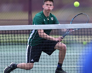 MICHAEL G TAYLOR | THE VINDICATOR- 05-13-17  Tennis -  D2 Tennis Sectional at Boardman High School in Boardman, OH.During the 1st set of their doubles match, Ursuline's Austin Arfaras digs out a low volley. Ursuline won the sectional title over Poland.