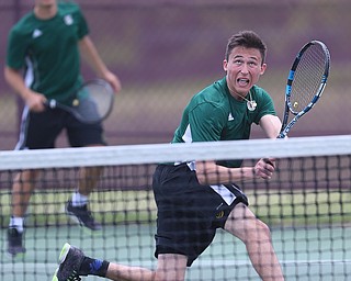MICHAEL G TAYLOR | THE VINDICATOR- 05-13-17  Tennis -  D2 Tennis Sectional at Boardman High School in Boardman, OH.During the 1st set of their doubles match, Ursuline's Austin Arfaras digs out a low volley. Ursuline won the sectional title over Poland.