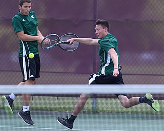 MICHAEL G TAYLOR | THE VINDICATOR- 05-13-17  Tennis -  D2 Tennis Sectional at Boardman High School in Boardman, OH.Ursuline's doubles team of Luke Tsudis (left) and Austin Arfaras go after the shot during their sectional title match win over Poland.