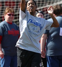 MICHAEL G TAYLOR | THE VINDICATOR- 05-13-17 Special Olympics 8th Annual Trumbull County Invitational at Arrowhead Stadium, Girard High School in Girard, OH.  .Opening cermony, Trumbull County Special Olympics, Fairhaven Bulldogs team member, Andrea Mckinna competes in the softball throw