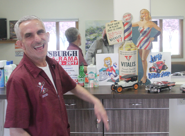 William D. Lewis The Vindicator Barber Bob Leonelli shares a laugh as he talks about nostalgic decor in his Boardman barbershop.