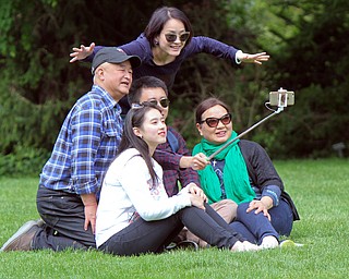 William D. Lewis The Vindicator  Tiffany Zhou of Youngstown and her family take a selfie at Fellows Riverside Gardens in Mill Creek Park Sunday May 14,2017. Mothers Day is one of the busiest days of the year at the gardens.