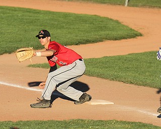 William D. Lewis The Vindicator  Poland's Branden O'Shaughnessy) is out at first as Canfield'sSpencer Woolley(2) makes the catch during 5-15-17 game at cene..