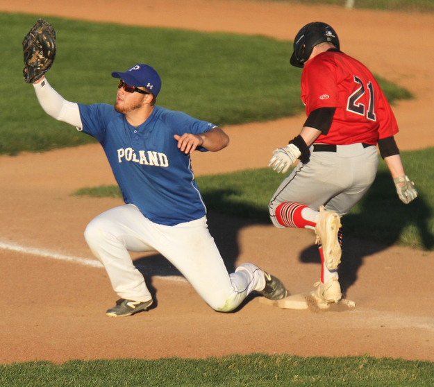 William D. Lewis The Vindicator  Canfild's Mark Whittman(21) is out at first as Poland's Padraig O'Shaughnessy(21) make the tag during 5-15-17 game at cene..