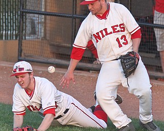 William D. Lewis The Vindicator Niles Tyler Woak(17) and Tyler Srbinovich(13) try to catch a foul ball during gamesat Cene 5-16-17
