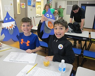 Neighbors | Alexis Bartolomucci.Johnny Turner and Massimo Patrone held up the sharks they made during the Family Science Night at Poland Union.