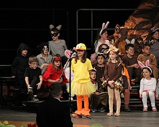 Neighbors | Abby Slanker.A first-grade student, dressed as a duck, took her turn at the microphone during the school’s production of “The Bear Went Over the Mountain - A Musical Journey of Friendship and Adventure” on April 10.