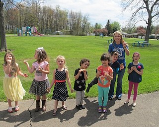 Neighbors | Alexis Bartolomucci.Samantha Cox and her students ate s'mores they made on April 21 for Earth Day at Poland North Preschool.