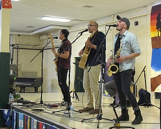 Neighbors | Alexis Bartolomucci.Local band, The Labra Bros, performed at Ursuline High School's Fiesta de las Americas event on April 26.