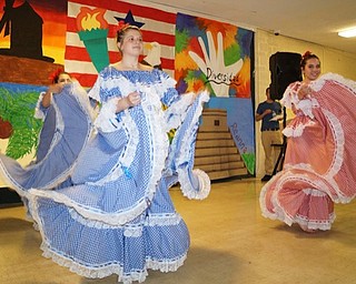 Neighbors | Submitted.Seniors at Ursuline High School performed a Columbian Cubia dance during the Fiesta de las Americas on April 26.