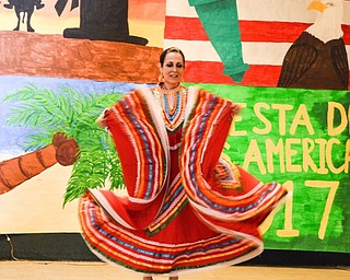 Neighbors | Submitted.Seniora Paulina Montaldo performed a mariachi dance for the Fiesta de las Americas at Ursuline High School on April 26.