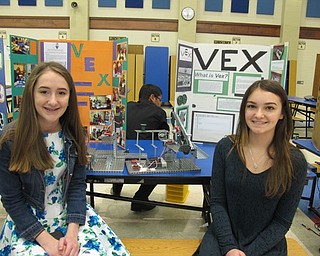 Neighbors | Alexis Bartolomucci.Cally and Gabrielle sat next to their STEM projects on May 4 during the Austintown Middle School STEM Showcase.