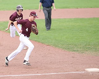 Boardman third baseman Mike Fetsko(4) runs towards third to beat Walsh runner Kasen Anzelc(9) during the 7th inning as the Boardman takes on Walsh Jesuit in the Division I District final, Friday, May 19, 2017 at Bob Cene Park in Struthers...(Nikos Frazier | The Vindicator)..
