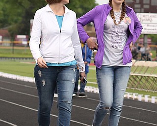Lisa Bennett(left) and daughter Katie(16) of South Range walk during the Relay for Life event at Boardman Spartan Stadium, Friday, May 19, 2017 in Boardman. ..(Nikos Frazier | The Vindicator)