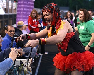 Brian "Fiona Fire Cracker" Patterson of New Castle, runs around raising money while participating in the  "Miss Relay"  during the Relay for Life event at Boardman Spartan Stadium, Friday, May 19, 2017 in Boardman. ..(Nikos Frazier | The Vindicator)