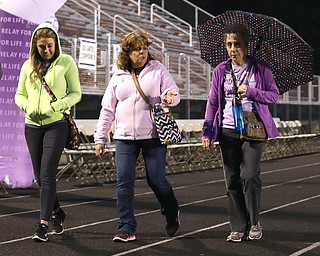 (From right) Rose Vocature of Loweville, Kim Thompson of Austintown and daughter Megan, walk during the Relay for Life event at Boardman Spartan Stadium, Friday, May 19, 2017 in Boardman. ..(Nikos Frazier | The Vindicator)