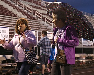 (From right) Rose Vocature of Loweville abd Kim Thompson of Austintown walk during the Relay for Life event at Boardman Spartan Stadium, Friday, May 19, 2017 in Boardman. ..(Nikos Frazier | The Vindicator)