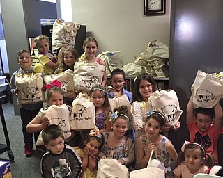 SPECIAL TO THE VINDICATOR
Girard First United Methodist Church recently hosted “Project Night Night,” a children’s benefit. Members filled tote bags that will be given to children in homeless shelters and temporary living situations. Items in the bags included stuffed animals, books and small blankets. Students from the church children’s program K’Motion helped fill 65 bags. Polly Fleming led the program. For information, call the church office at 330-545-4361.
