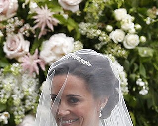 Pippa Middleton arrives for her wedding to James Matthews at St Mark's Church in Englefield, England Saturday, May 20, 2017. Middleton, the sister of Kate, Duchess of Cambridge is to marry hedge fund manager James Matthews in a ceremony Saturday where her niece and nephew Prince George and Princess Charlotte are in the wedding party, along with sister Kate and princes Harry and William. (AP Photo/Kirsty Wigglesworth, Pool)