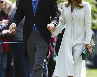 David and Jane Matthews, parents of the groom, attend the wedding ceremony of Pippa Middleton to James Matthews, at St Mark's Church in Englefield, England Saturday, May 20, 2017. Middleton, the sister of Kate, Duchess of Cambridge married hedge fund manager James Matthews in a ceremony Saturday where her niece and nephew Prince George and Princess Charlotte was in the wedding party, along with sister Kate and princes Harry and William. (Justin Tallis/Pool Photo via AP)