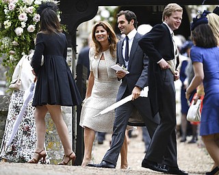 Swiss tennis player Roger Federer, centre right and his wife Mirka leave, after the wedding ceremony of Pippa Middleton to James Matthews, at St Mark's Church in Englefield, England Saturday, May 20, 2017. Middleton, the sister of Kate, Duchess of Cambridge married hedge fund manager James Matthews in a ceremony Saturday where her niece and nephew Prince George and Princess Charlotte was in the wedding party, along with sister Kate and princes Harry and William. (Justin Tallis/Pool Photo via AP)