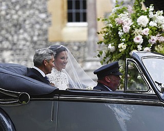 Pippa Middleton and father Michael arrive for her wedding to James Matthews, at St Markâ€™s Church in Englefield, England, Saturday, May 20, 2017. Middleton, the younger sister of Kate, Duchess of Cambridge is to marry hedge fund manager James Matthews in a ceremony Saturday where her niece and nephew Prince George and Princess Charlotte are in the wedding party, along with sister Kate and princes Harry and William. (Justin Tallis/Pool Photo via AP)