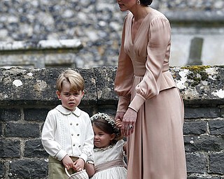 Britain's Kate, the Duchess of Cambridge, right, stands with her children Prince George and Princess Charlotte, following the wedding ceremony of her sister Pippa Middleton and James Matthews, at St Mark's Church in Englefield, England Saturday, May 20, 2017. Middleton, the sister of Kate, Duchess of Cambridge married hedge fund manager James Matthews in a ceremony Saturday where her niece and nephew Prince George and Princess Charlotte was in the wedding party, along with sister Kate and princes Harry and William. (Justin Tallis/Pool Photo via AP)