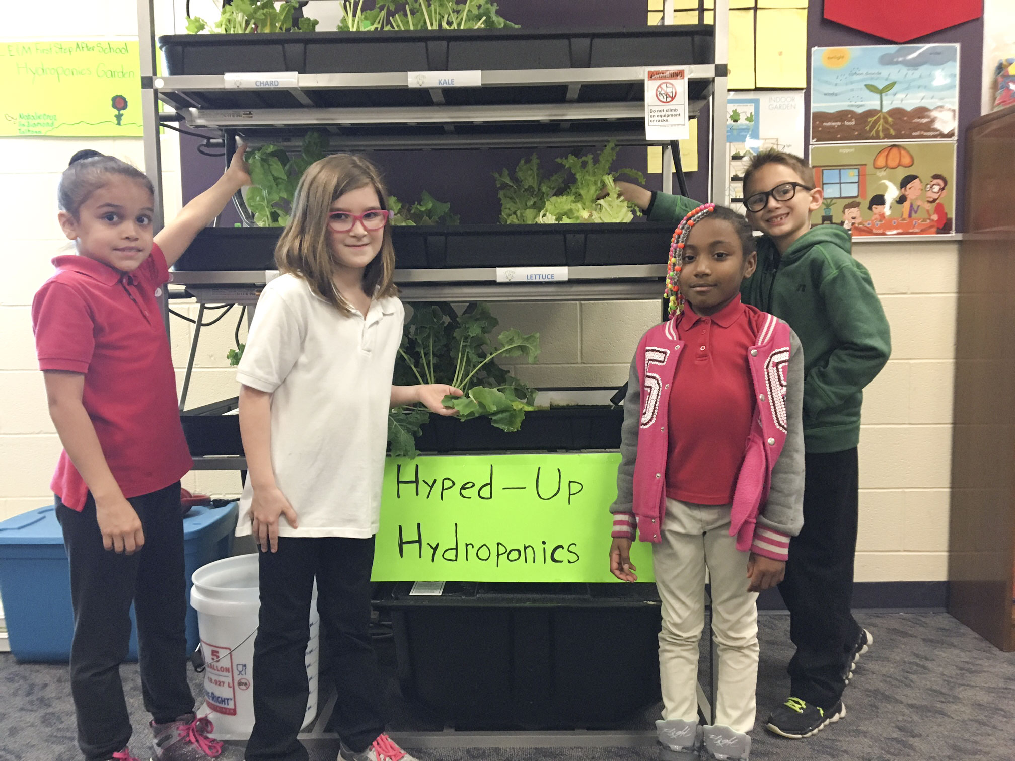 SPECIAL TO THE VINDICATOR
Campbell Elementary Middle School added a hydroponic learning lab as a part of its Youngstown State University After School Program. Students have harvested their plants and have eaten snacks made from the harvest. They harvested lettuce, kale, basil and swiss chard, and made salads and kale chips with the help of cafeteria staff. There were enough vegetables for students and teachers to take some home. Students, from left, are Juliexies Aponte, Emily Snitzer, Aniya Ellis and Vasilios Krinos.