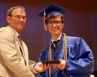 Board Member Don Newell presents Nicholas Adduci with his diploma during the Hubbard High School Commencement at Stambaugh Auditorium, Wednesday, May 24, 2017 in Youngstown.  ..(Nikos Frazier | The Vindicator)