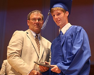 Board Member Don Newell presents Joshua Adams with his diploma during the Hubbard High School Commencement at Stambaugh Auditorium, Wednesday, May 24, 2017 in Youngstown.  ..(Nikos Frazier | The Vindicator)